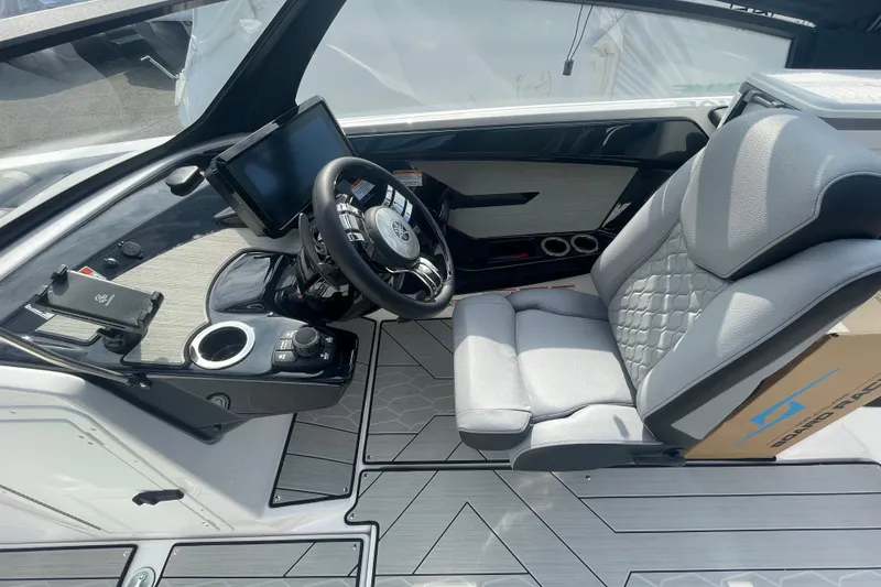 Slide: The Image of 2026 Yamaha Boats 222XD cockpit with modern steering and comfortable seating. - 5