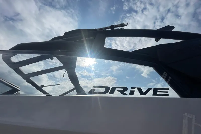 Slide: The Image of 2026 Yamaha Boats 222XD with "Drive" logo, sunlit against a cloudy sky. - 9