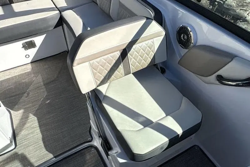 Slide: The Image of 2023 Monterey M6 boat interior with cushioned seating and speaker detail. - 9