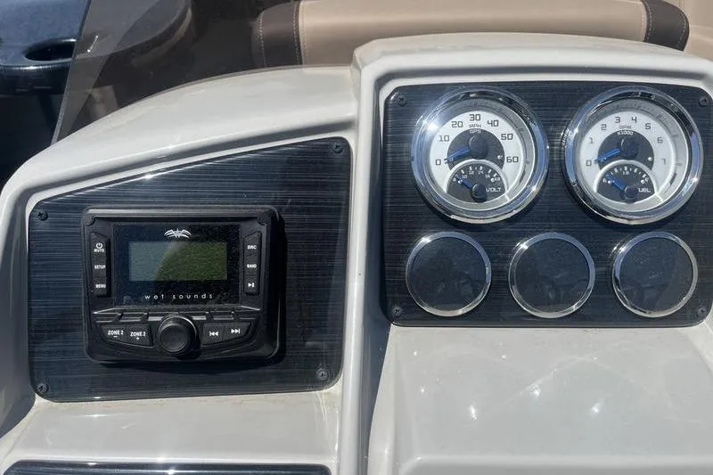 Slide: The Image of Dashboard of 2025 Sylvan Mirage 820 CLZ DH with gauges and sound system. - 10