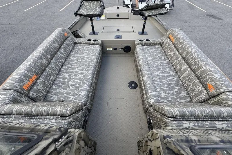 Slide: The Image of 2026 SeaArk EasyCat boat with camo-patterned seating and cup holders. - 10