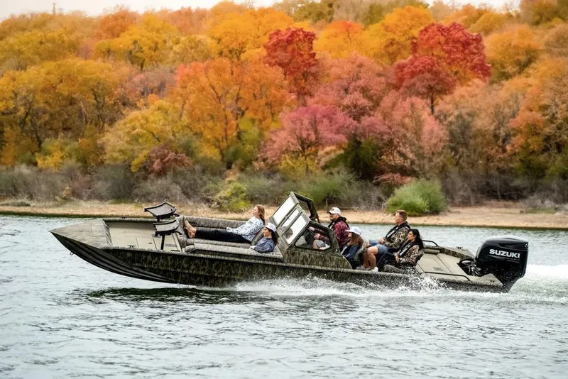 Slide: The Image of 2026 SeaArk EasyCat boat interior with camo-patterned seating and cup holders. - 15