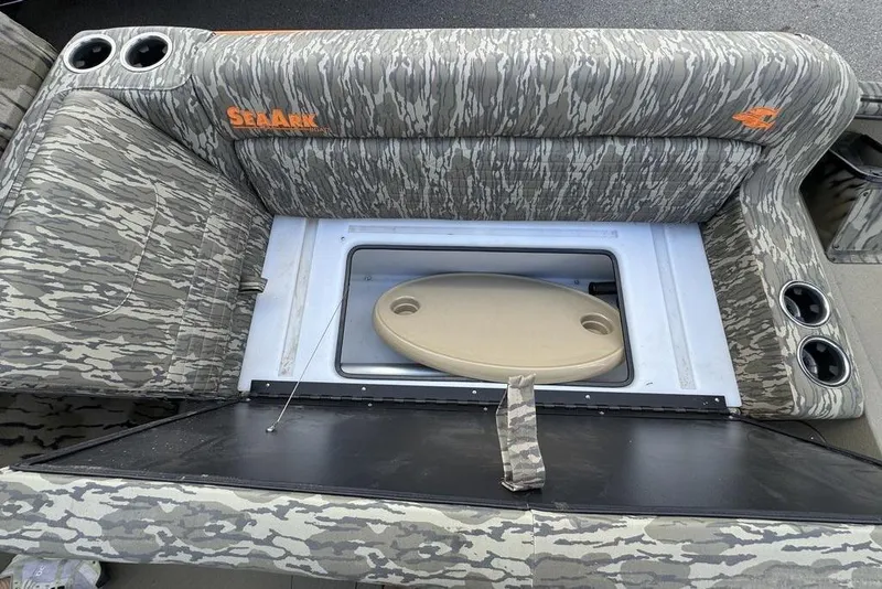 Slide: The Image of 2026 SeaArk EasyCat boat interior with camouflage design, featuring steering wheel and control panel. - 17