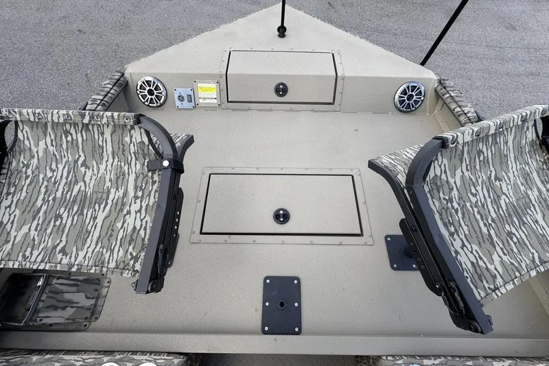 Slide: The Image of 2026 SeaArk EasyCat boat interior with camo seats and steering console. - 18