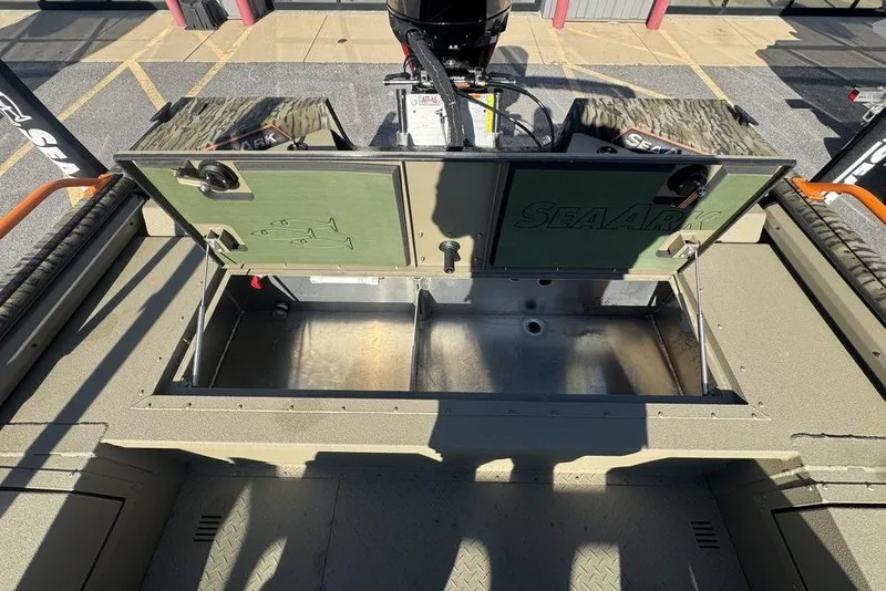 Slide: The Image of 2026 SeaArk EasyCat boat with open storage compartment and visible engine. - 25