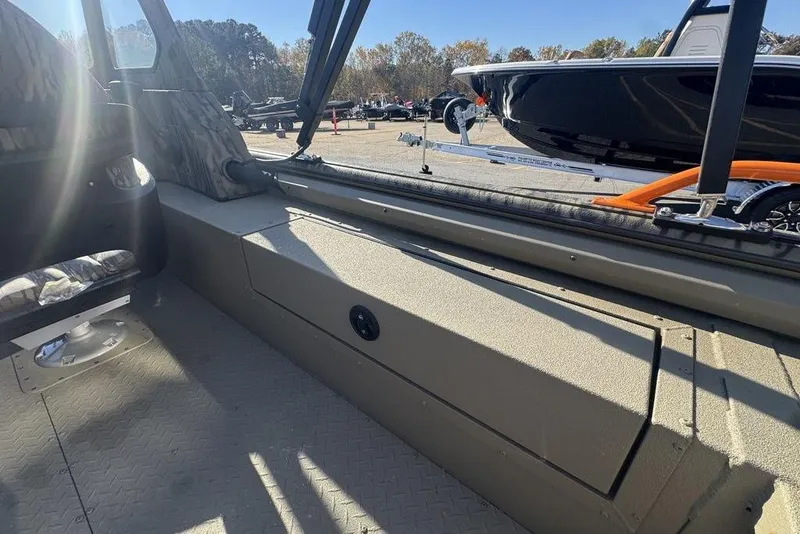 Slide: The Image of Interior view of 2026 SeaArk EasyCat boat with seating and storage. - 27