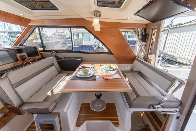Slide: The Image of Manufacturer Provided Image: Luxurious 2025 Cutwater C-32 C yacht interior with elegant dining area. - 9