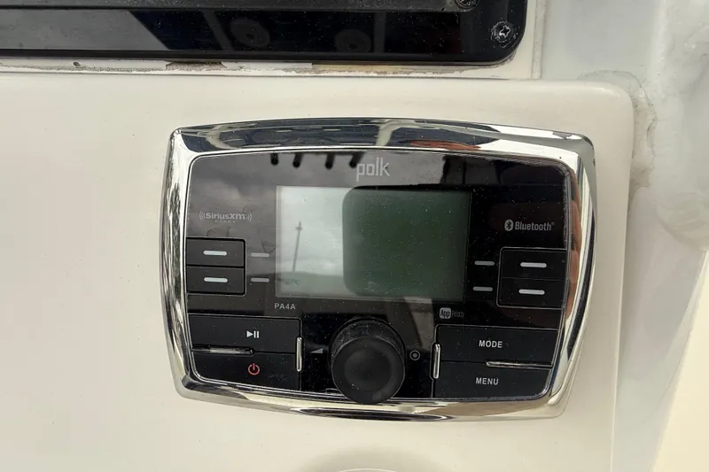 Slide: The Image of Polk audio system on 2017 Tidewater 230 LXF boat, featuring Bluetooth and SiriusXM. - 12