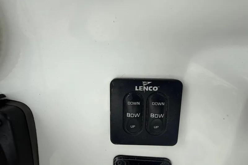 Slide: The Image of Lenco trim tab controls on 2017 Tidewater 230 LXF boat dashboard. - 13