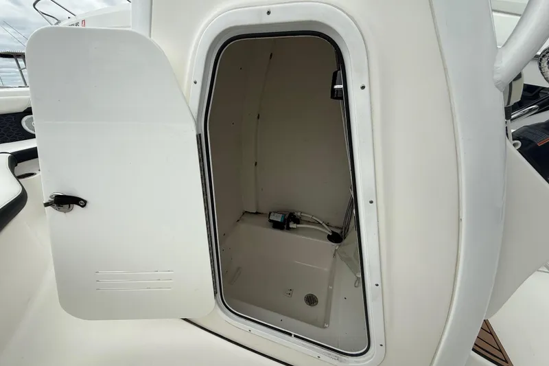 Slide: The Image of Open storage compartment on a 2017 Tidewater 230 LXF boat. - 21