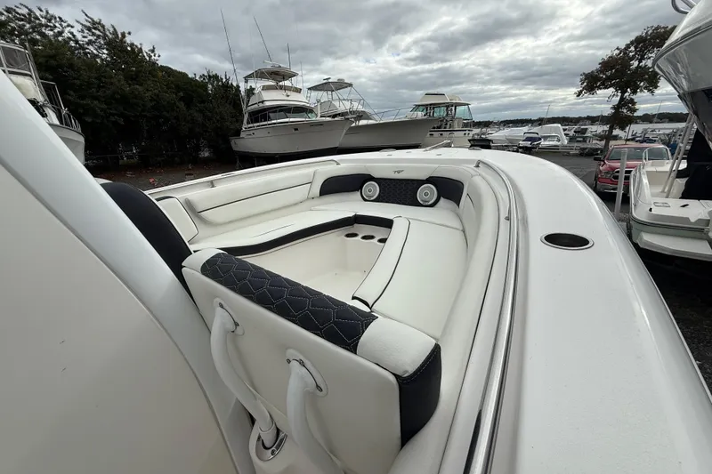 Slide: The Image of 2017 Tidewater 230 LXF boat interior with white seating and cup holders. - 25