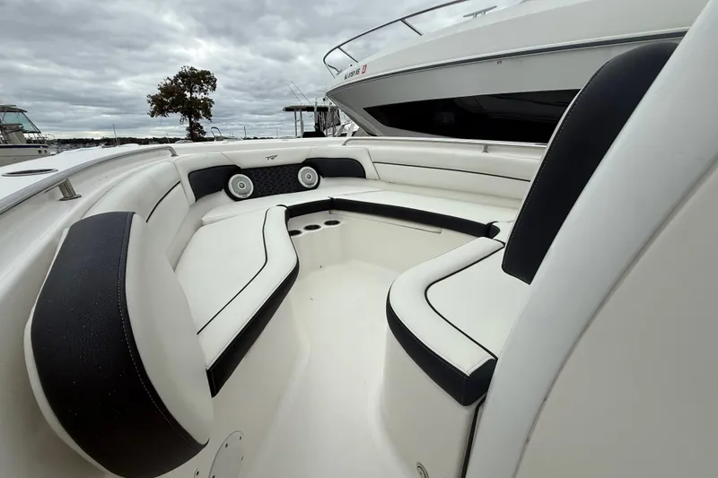 Slide: The Image of 2017 Tidewater 230 LXF boat interior with cushioned seating and cup holders. - 3