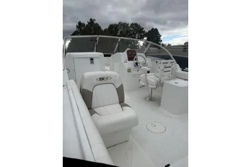 Slide: The Image of 2011 Sea Hunt Escape 207 LE boat interior with seating and steering console. - 2