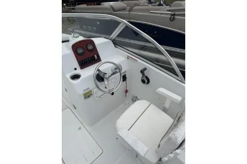 Slide: The Image of 2011 Sea Hunt Escape 207 LE boat interior with steering wheel and dashboard. - 4