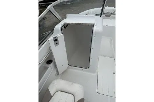 Slide: The Image of 2011 Sea Hunt Escape 207 LE boat interior with open storage compartment. - 5