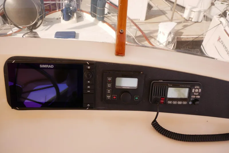 Slide: The Image of Control panel of a 1985 Tollycraft 48 Cockpit Motor Yacht with navigation equipment. - 12