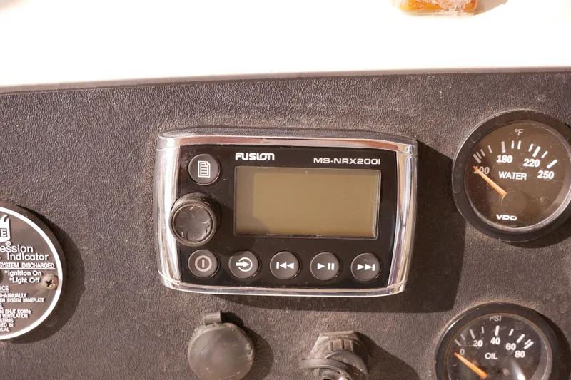 Slide: The Image of Fusion MS-NRX200i stereo system on 1985 Tollycraft 48 Cockpit Motor Yacht dashboard. - 21