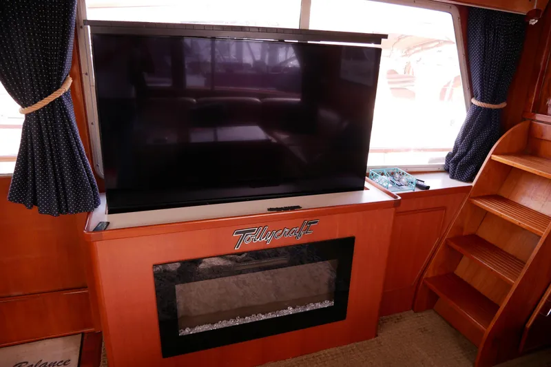 Slide: The Image of Interior of 1985 Tollycraft 48 Cockpit Motor Yacht with TV and fireplace. - 33