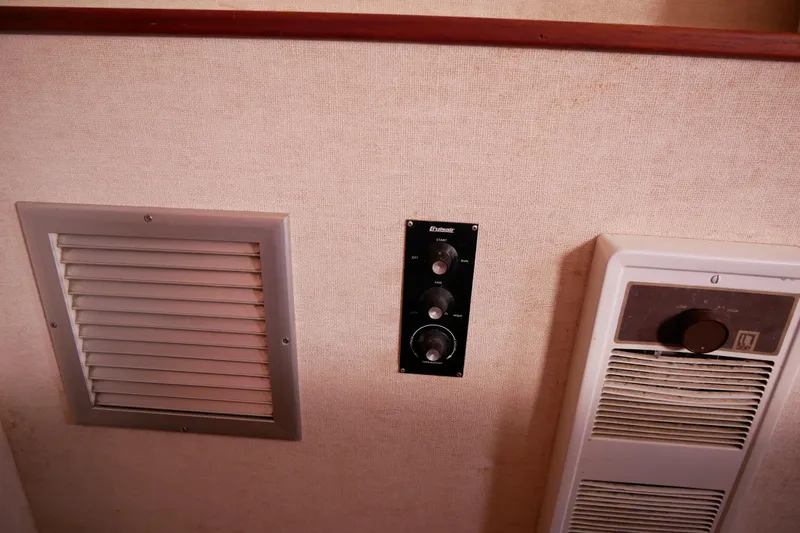 Slide: The Image of 1985 Tollycraft 48 Cockpit Motor Yacht interior controls and ventilation system. - 40