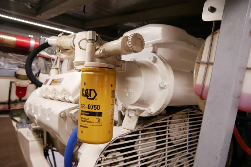 Slide: The Image of Engine room of 1985 Tollycraft 48 Cockpit Motor Yacht with CAT fuel filter. - 49