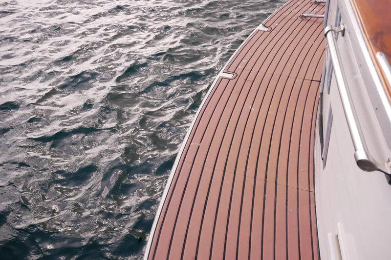 Slide: The Image of 1985 Tollycraft 48 Cockpit Motor Yacht deck overlooking water. - 5