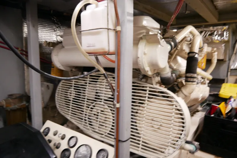 Slide: The Image of Engine room of 1985 Tollycraft 48 Cockpit Motor Yacht with visible machinery and controls. - 50
