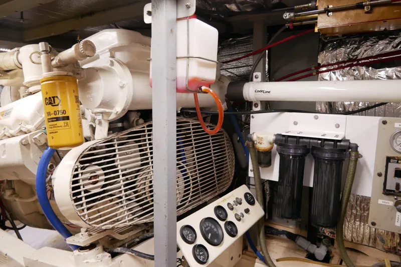 Slide: The Image of Engine room of 1985 Tollycraft 48 Cockpit Motor Yacht with CAT filter and gauges. - 51