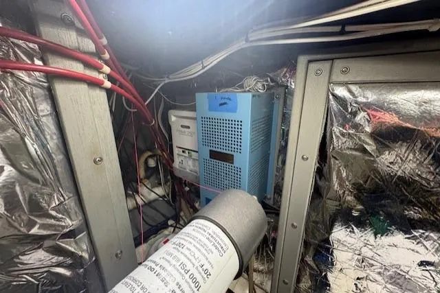Slide: The Image of Engine room of 1985 Tollycraft 48 Cockpit Motor Yacht with wiring and equipment. - 53