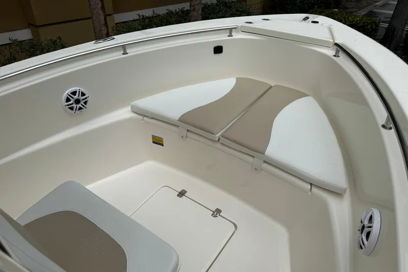 Slide: The Image of 2026 Bulls Bay 230 Center Console boat interior with cushioned seating and speakers. - 10