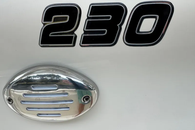 Slide: The Image of 2026 Bulls Bay 230 Center Console boat emblem and vent detail. - 16