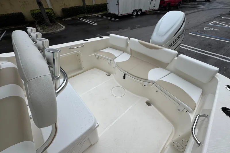 Slide: The Image of 2026 Bulls Bay 230 Center Console boat interior with seating and rod holders. - 5