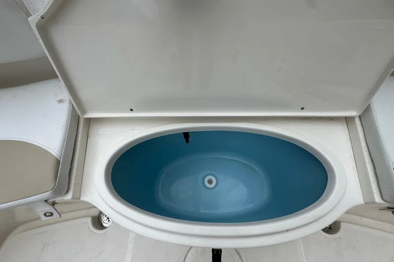 Slide: The Image of Livewell on 2026 Bulls Bay 230 Center Console boat, open lid view. - 6