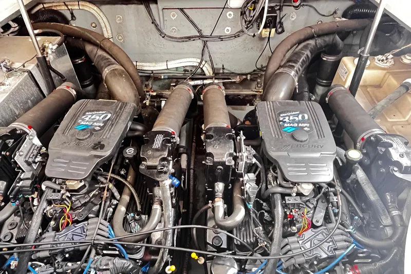 Slide: The Image of Twin MerCruiser 350 MAG MPI engines in a 2004 Sea Ray 320 Sundancer boat. - 11