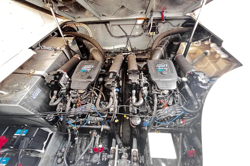 Slide: The Image of Engine compartment of a 2004 Sea Ray 320 Sundancer with twin Mercury 350 MAG MPI engines. - 12