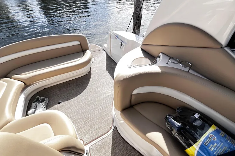 Slide: The Image of Interior of 2004 Sea Ray 320 Sundancer with beige seating and water view. - 23