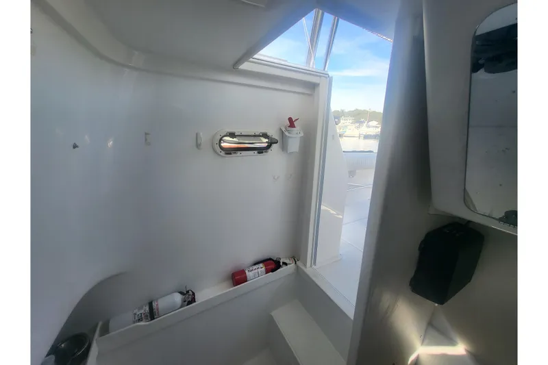 Slide: The Image of Interior view of 2005 Stamas 310 Tarpon boat, featuring a compact cabin space. - 100