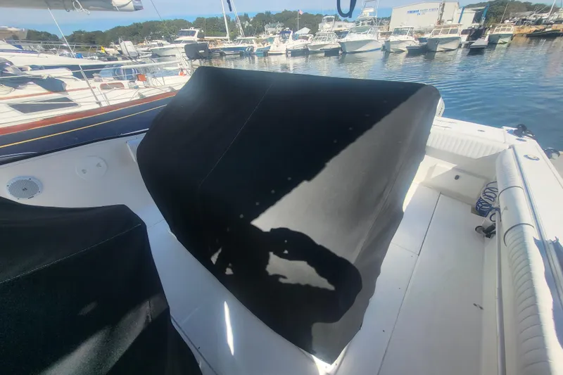 Slide: The Image of 2005 Stamas 310 Tarpon boat interior with covered console, docked in marina. - 15