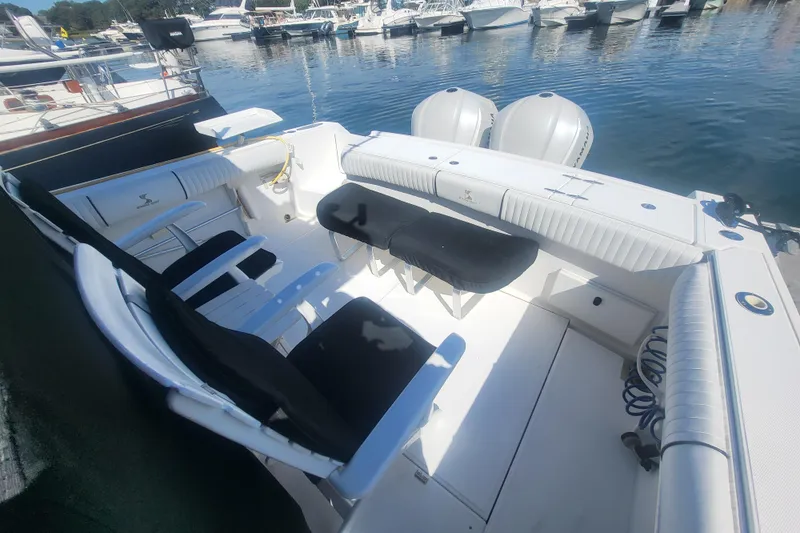 Slide: The Image of 2005 Stamas 310 Tarpon boat interior with seating, docked at marina. - 18