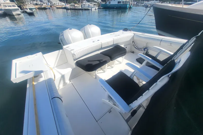 Slide: The Image of 2005 Stamas 310 Tarpon boat interior with seating, docked in marina. - 19