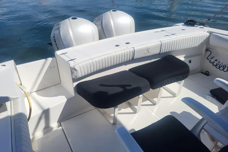 Slide: The Image of 2005 Stamas 310 Tarpon boat interior with seating and dual Yamaha outboard engines. - 20