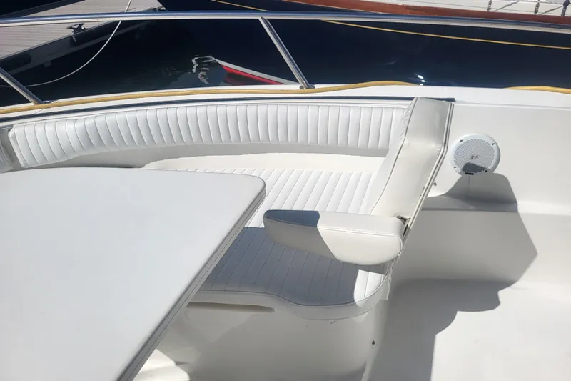 Slide: The Image of 2005 Stamas 310 Tarpon boat interior with white seating and table. - 31