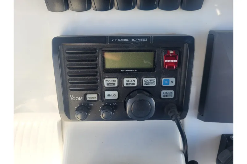 Slide: The Image of ICOM VHF Marine IC-M502 radio on 2005 Stamas 310 Tarpon boat dashboard. - 49