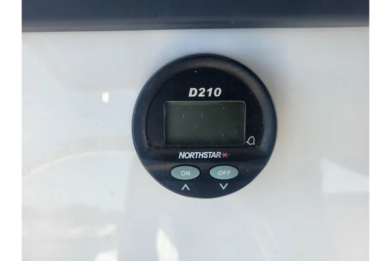 Slide: The Image of Digital display on a 2005 Stamas 310 Tarpon boat, featuring Northstar D210. - 52