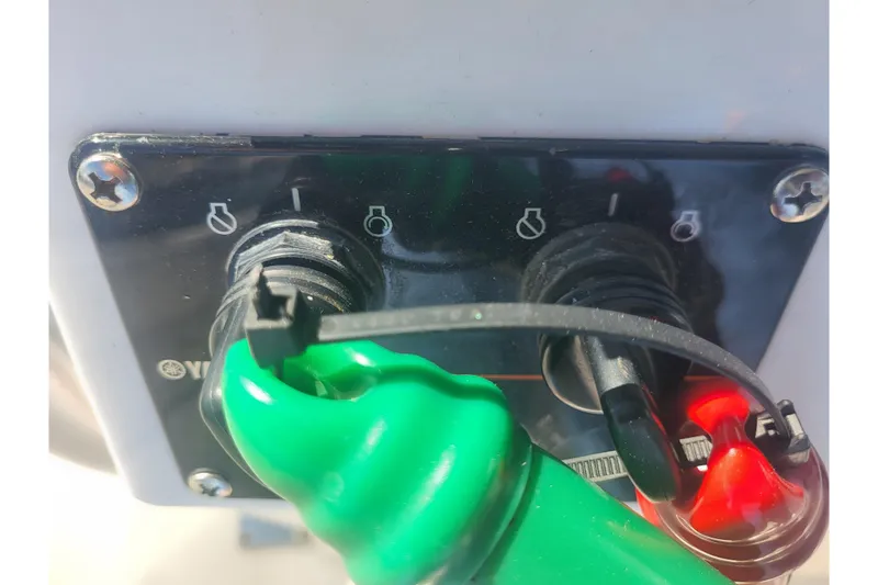 Slide: The Image of Close-up of ignition switches on a 2005 Stamas 310 Tarpon boat. - 55