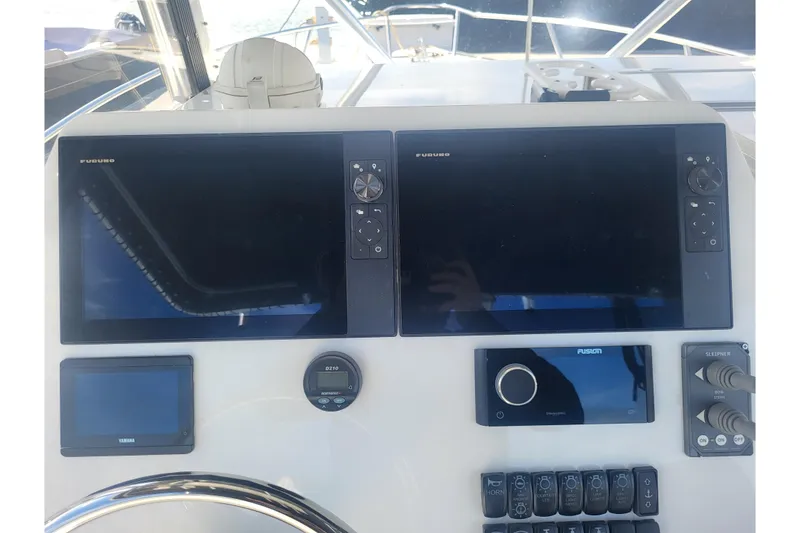 Slide: The Image of Dashboard of 2005 Stamas 310 Tarpon boat with navigation and control systems. - 57