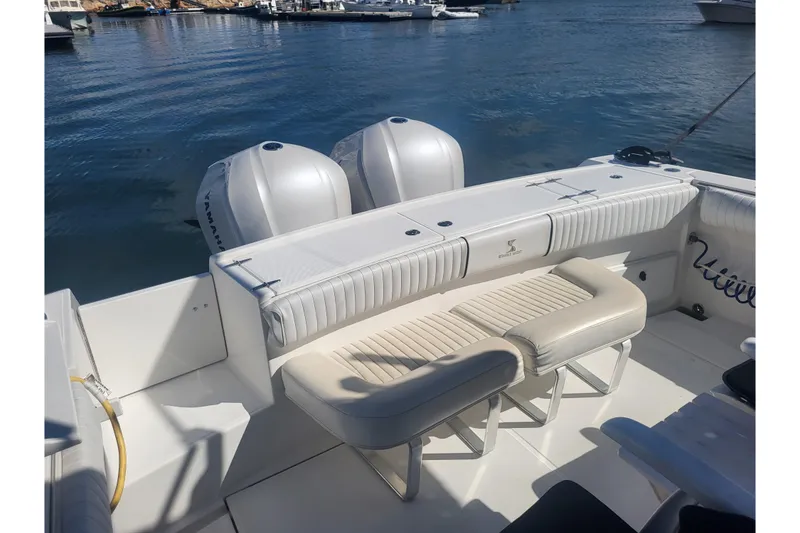 Slide: The Image of 2005 Stamas 310 Tarpon boat interior with dual Yamaha engines at dock. - 70
