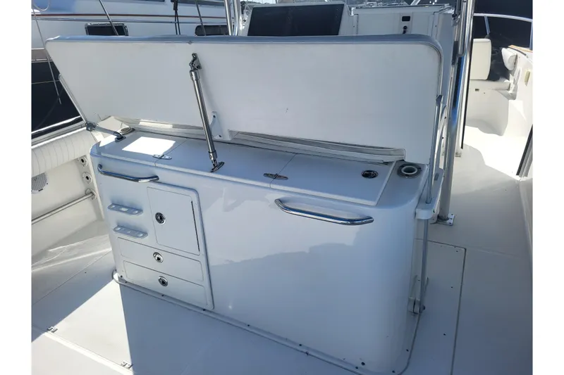 Slide: The Image of 2005 Stamas 310 Tarpon boat interior with storage compartments and seating area. - 87