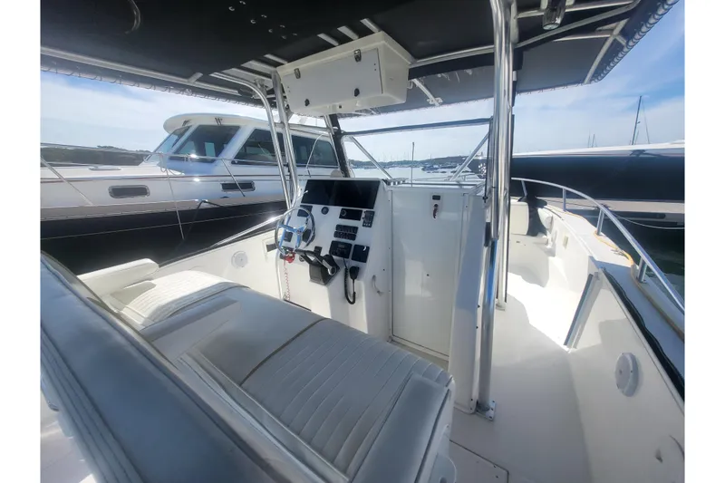 Slide: The Image of 2005 Stamas 310 Tarpon boat interior with steering console and seating. - 93