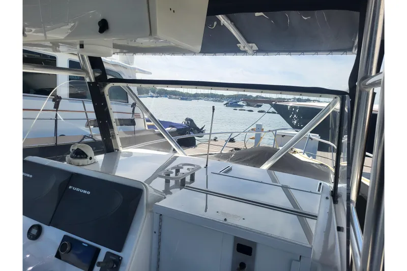 Slide: The Image of 2005 Stamas 310 Tarpon boat interior with navigation equipment, docked at marina. - 94