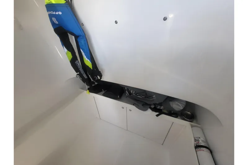 Slide: The Image of Interior storage of 2005 Stamas 310 Tarpon boat with life jackets and equipment. - 96